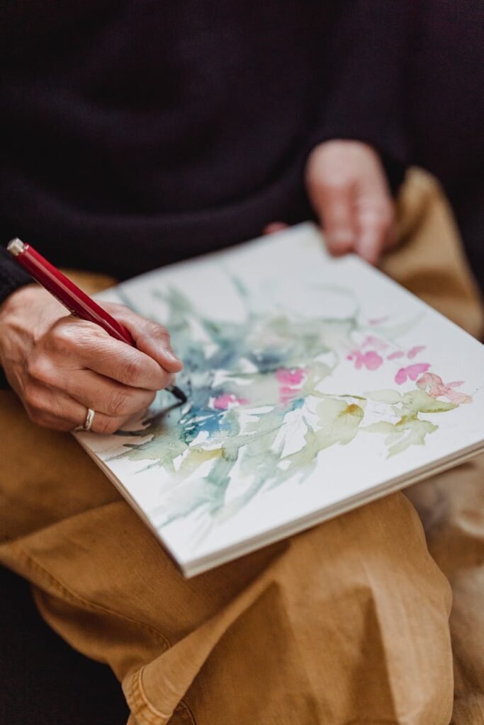 person drawing an artwork